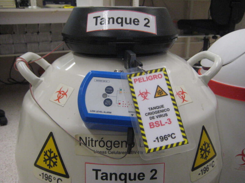 photo of a liquid nitrogen viral storage tank with a biosecurity tag on it